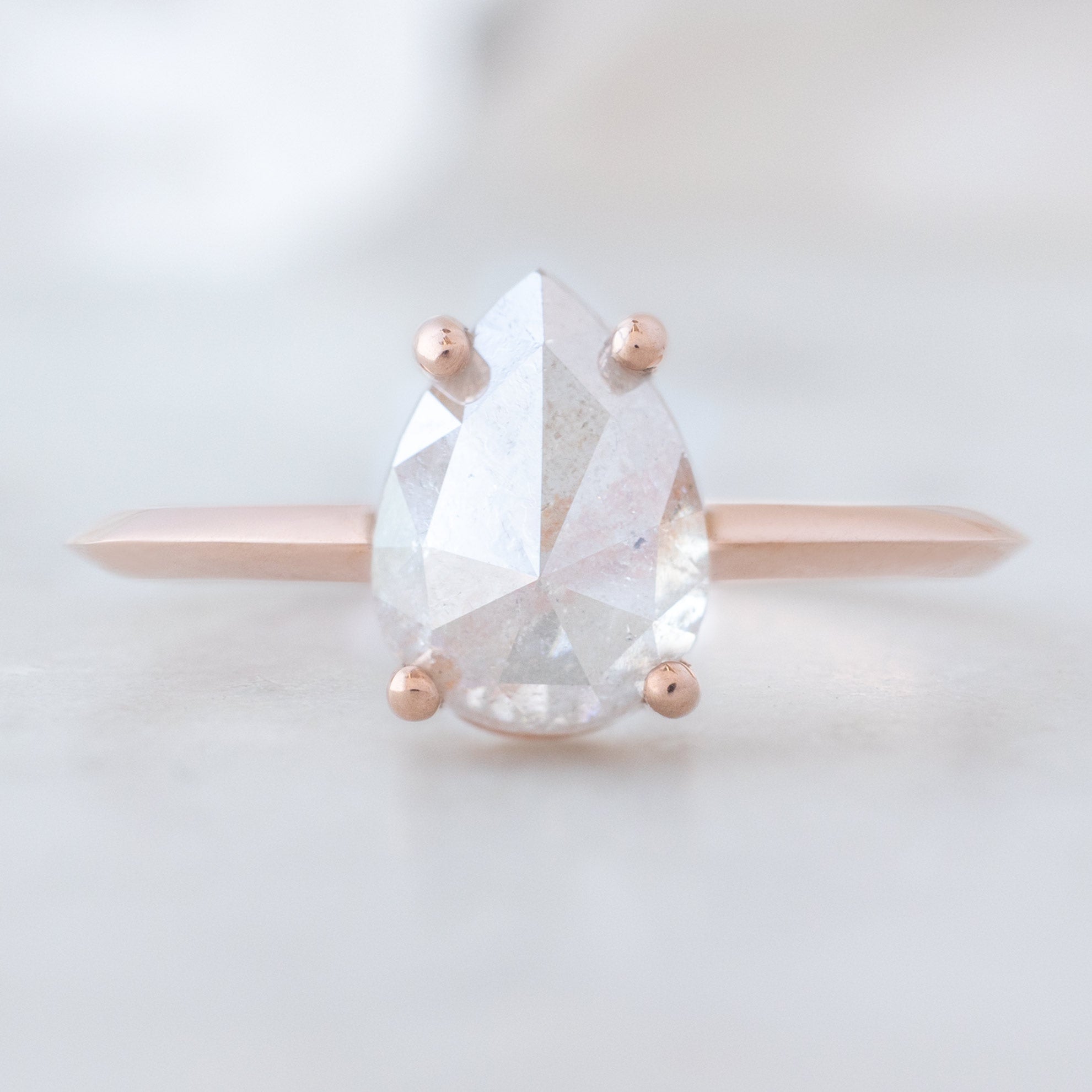 The Bryn Ring with a 1.76ct Pear Pink Diamond in 14K Rose Gold on white background