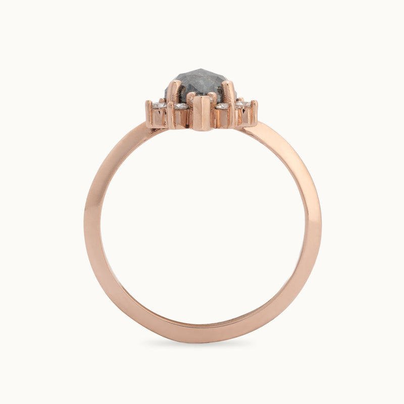 Profile View of The Aster Ring with a 1.41ct Pear Black Diamond in 14K Rose Gold on White Background