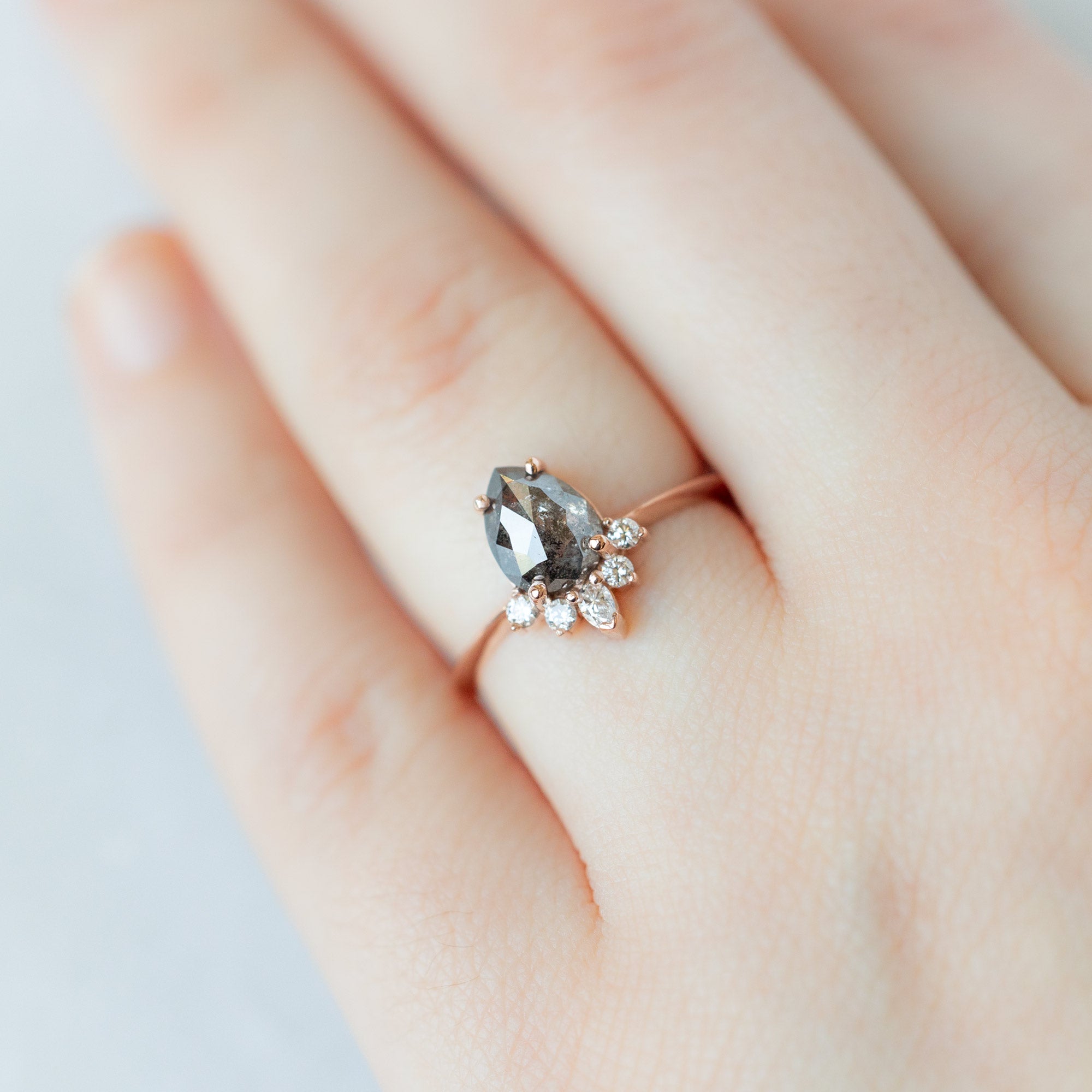 The Aster Ring with a 1.41ct Pear Black Diamond in 14K Rose Gold on Model