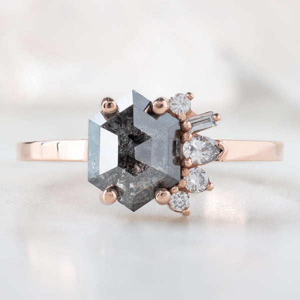 The Cluster Ring with a 1.07ct Hexagon Black Diamond in 14K Rose Gold on White Marble