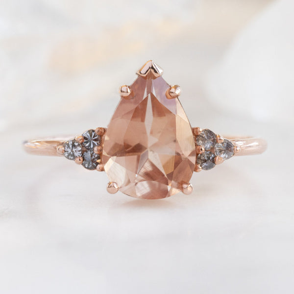 The Ivy Ring with a 1.87ct Pear Sunstone in 14K Rose Gold on White Marble