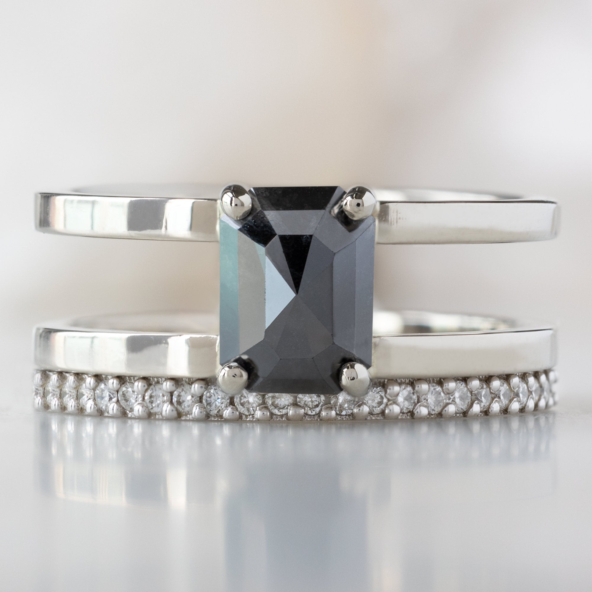 buy:the-poppy-ring-1-44ct-emerald-cut-black-diamond-in-14k-white-gold,the-white-diamond-pave-wedding-band-14k-or-18k-white-gold