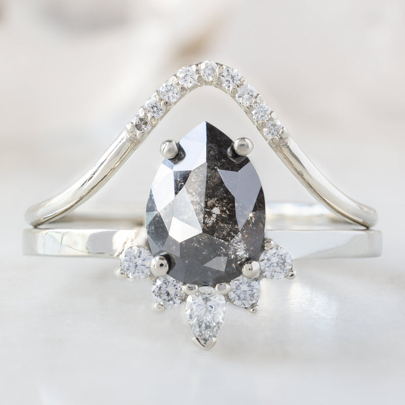 The Aster Ring with a 1.55ct Pear Black Diamond with White Diamond Pavé Peak Stacking Band