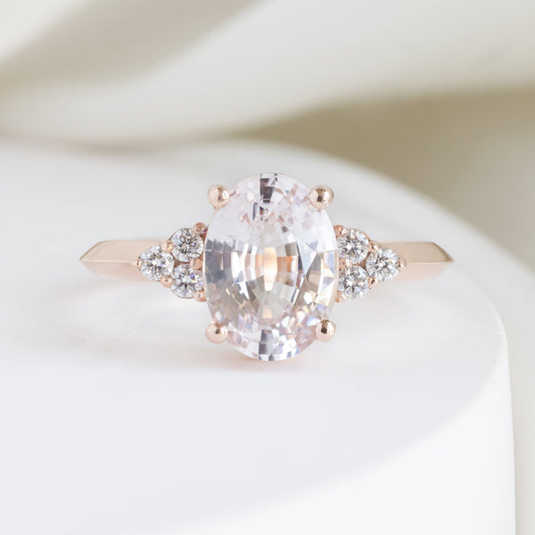 The Ivy Luxe with a 2.12ct Oval Peach Sapphire in 18K Rose Gold on White Marble