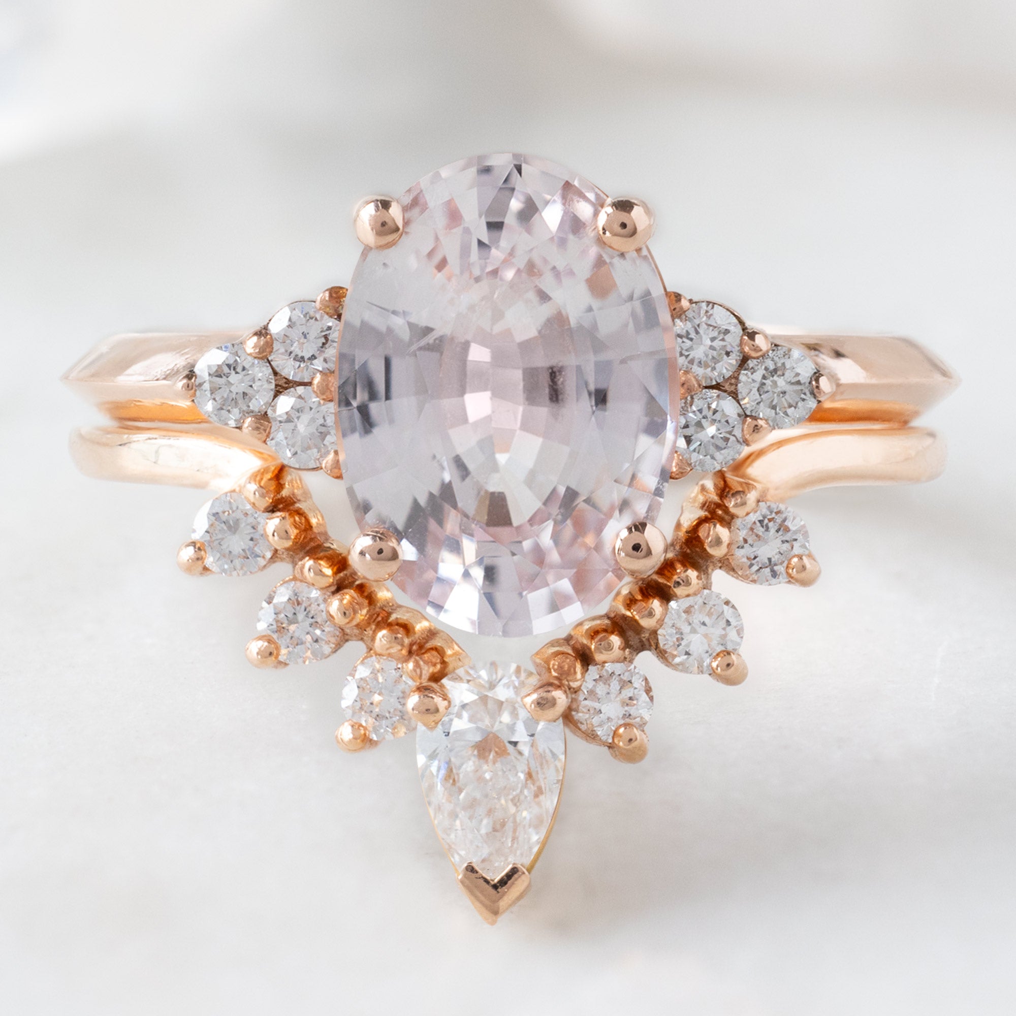 buy:the-ivy-ring-2-12ct-oval-cut-peach-sapphire-in-18k-rose-gold,white-pear-diamond-sunburst-stacking-band-14k-gold