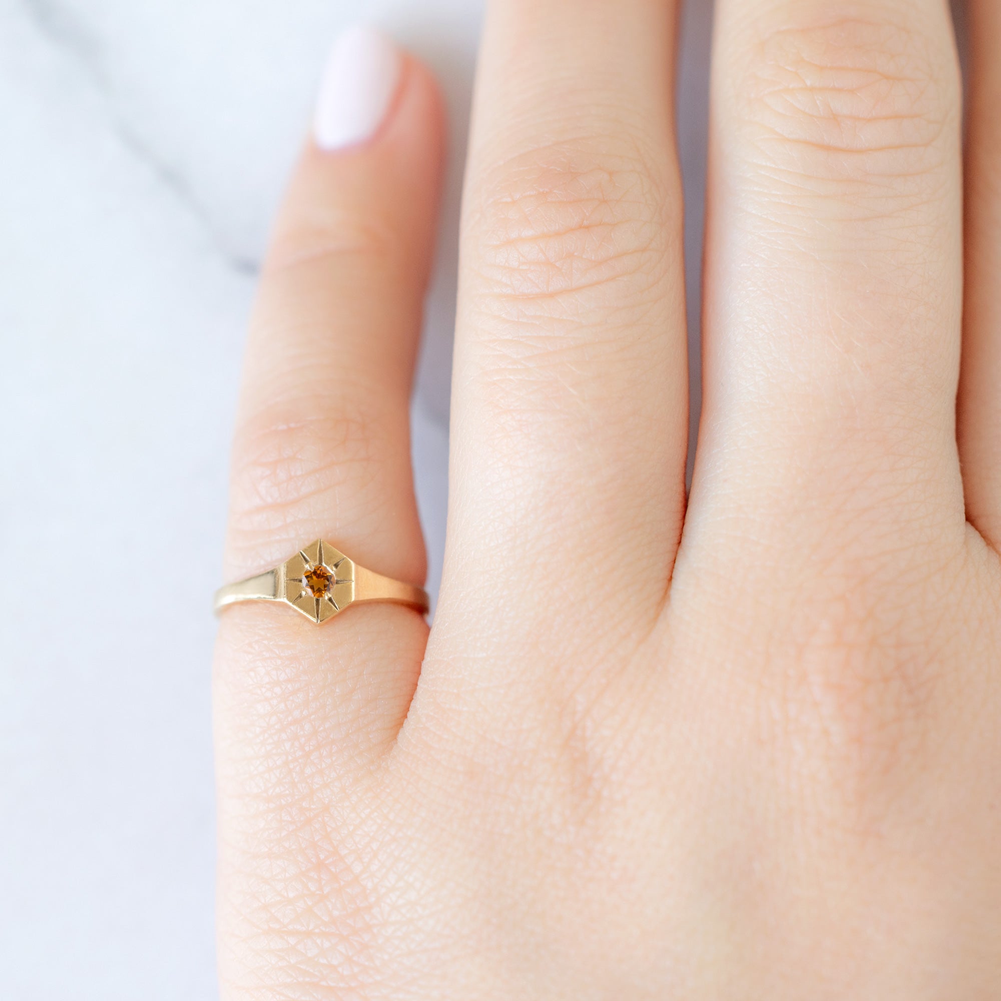 Custom Citrine Birthstone Signet Ring | 10K Yellow Gold displayed on model's left hand pinky finger. 