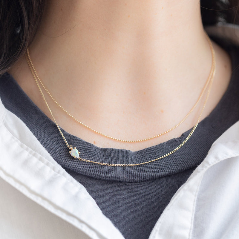 buy:the-bead-chain-necklace-14k-yellow-gold,the-asymmetrical-opal-diamond-necklace-gold-filled