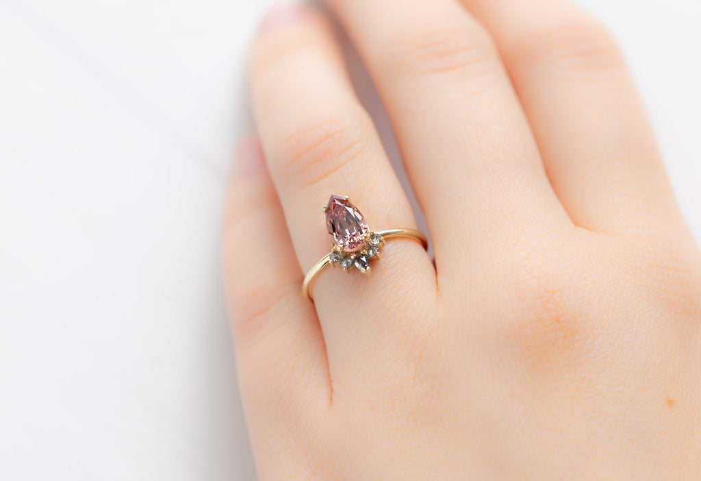 The Aster Ring with a 1.59ct Pear-Cut Garnet on Model