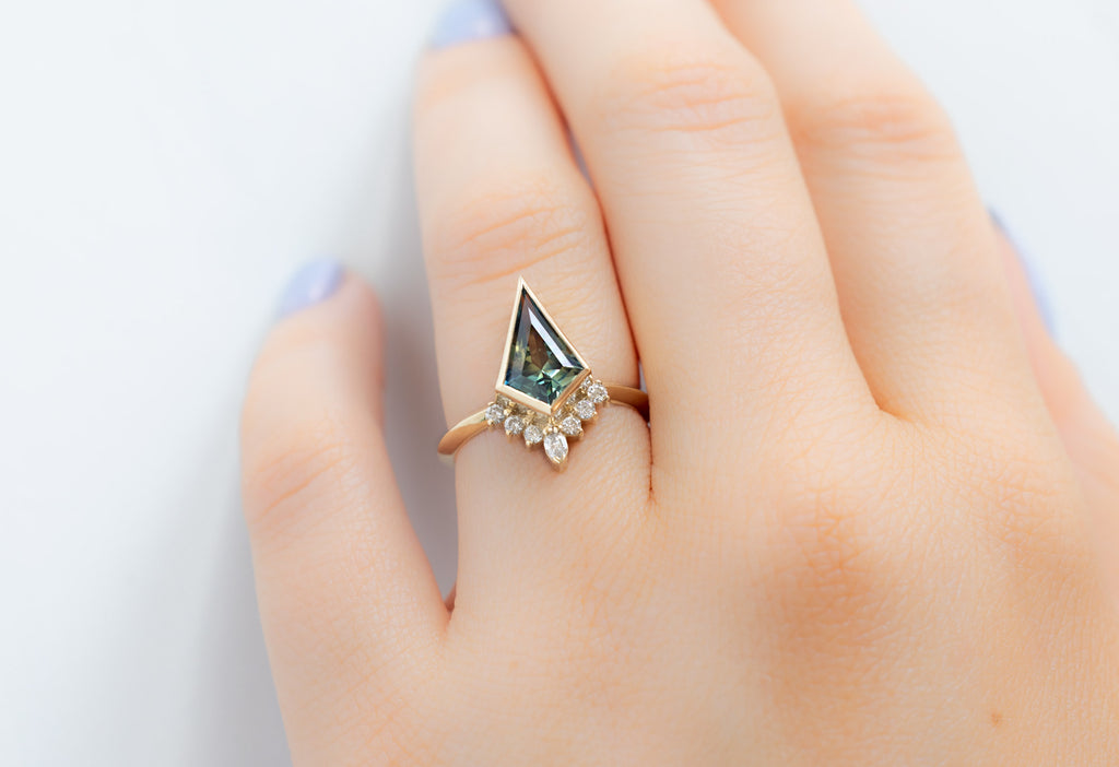 The Aster Ring with a Kite-Shaped Parti Sapphire on Model