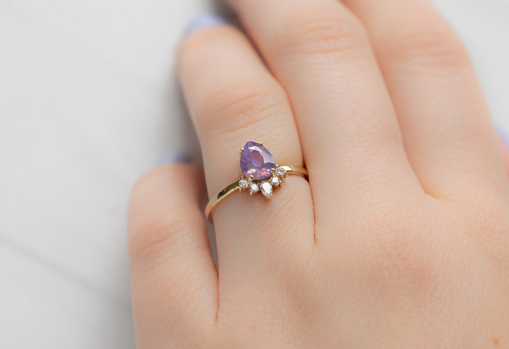 The Aster Ring with a Pear-Cut Orchid Sapphire on Model