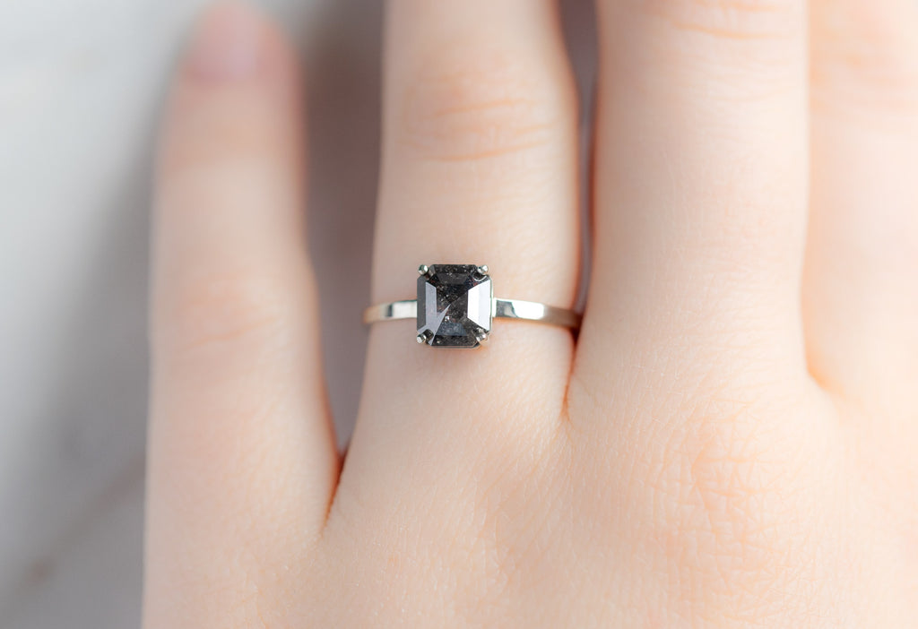 The Bryn Ring with an Emerald-Cut Black Diamond on Model