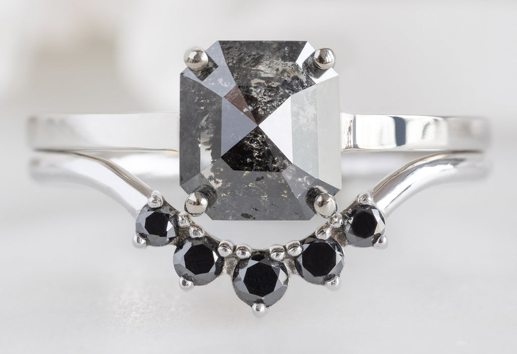 The Bryn Ring with an Emerald-Cut Black Diamond with RoRound Black Diamond Sunburst Stacking Band