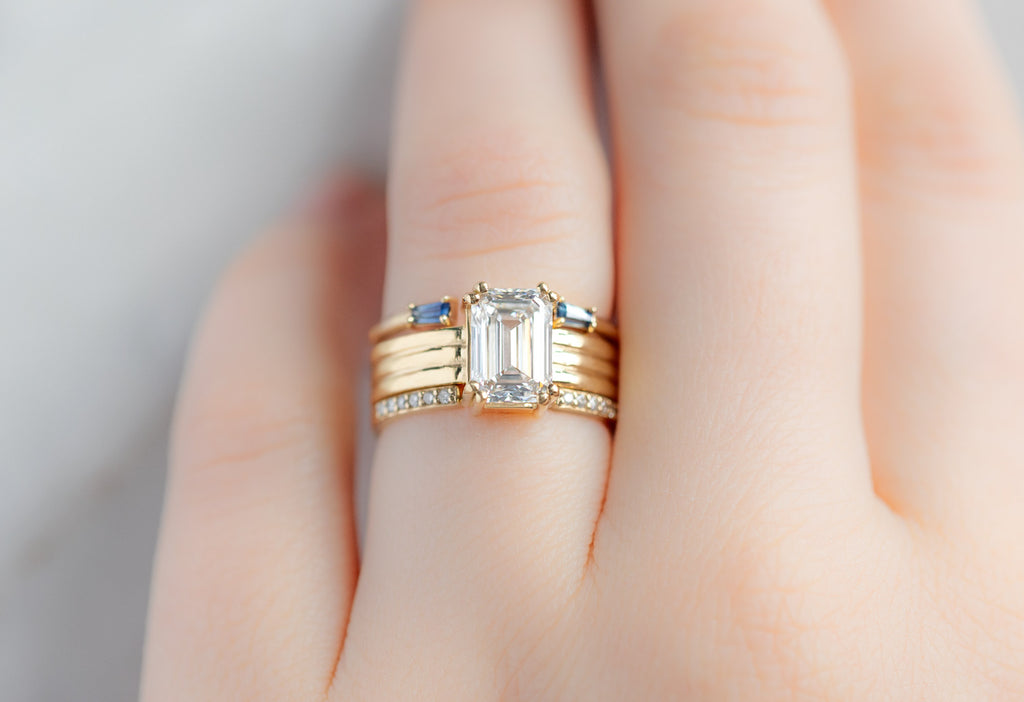 The Bryn Ring with an Emerald-Cut Lab Grown Diamond with Open Cuff Stacking Bands on Model