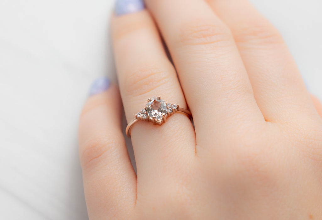 The Ivy Ring with a Peach Sapphire on Model