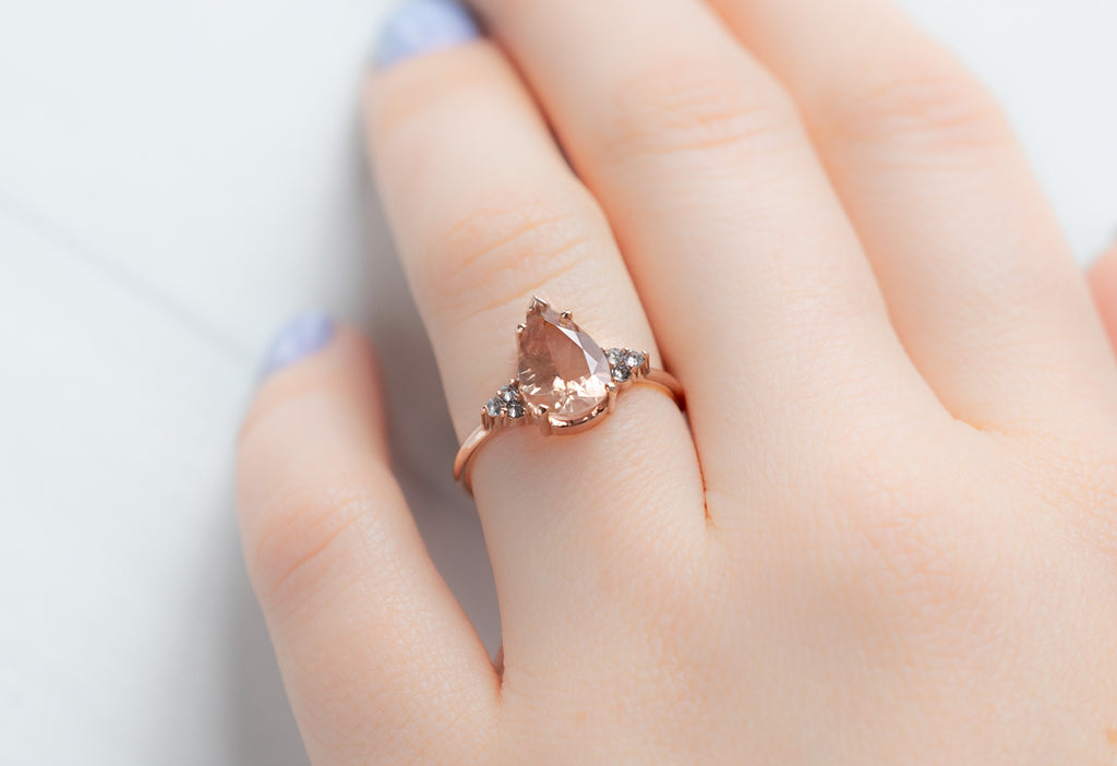 The Ivy Ring with a Pear-Cut Sunstone on Model