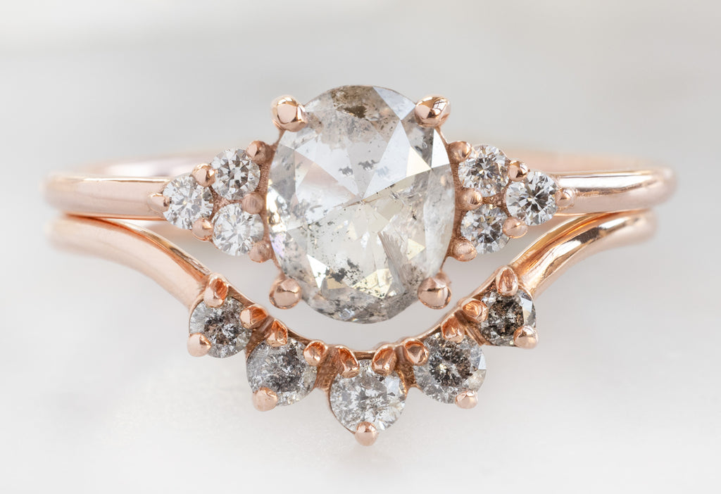 The Ivy Ring with an Oval-Cut Salt and Pepper Diamond with the Round Diamond Sunburst Stacking Band