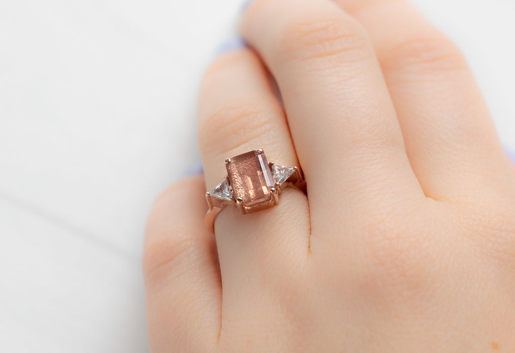 The Jade Ring with an Emerald-Cut Sunstone on Model