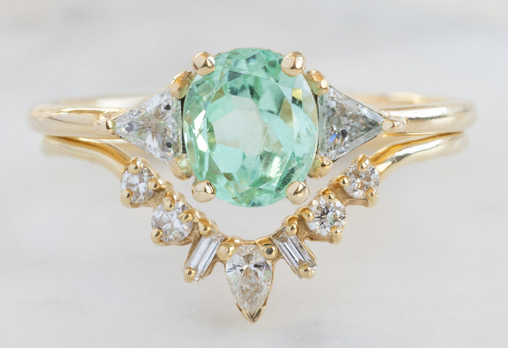 The Jade Ring with an Oval-Cut Emerald with Geometric Diamond Sunburst Stacking Band