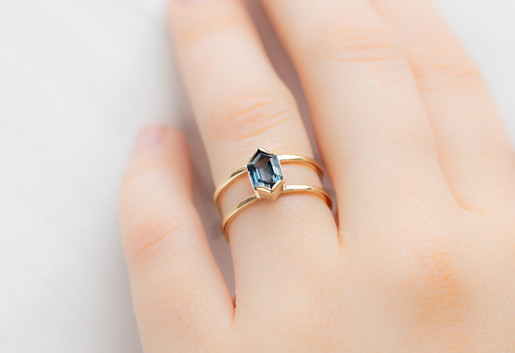 The Poppy Ring with a Sapphire Hexagon on Model
