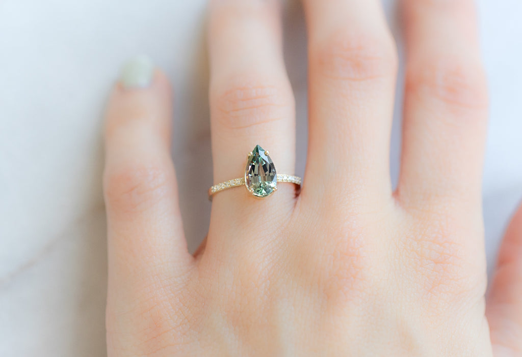 The Willow Ring with a Pear-Cut Tanzanite on Model