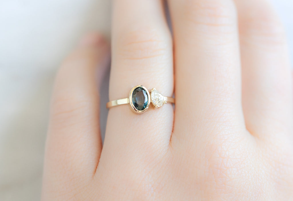 The You & Me Ring with a Blue Sapphire + White Diamond on Model