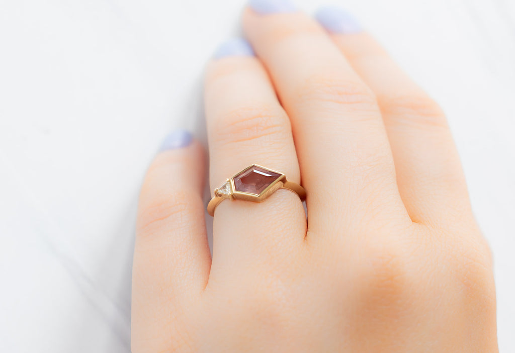 The You & Me Ring with an Orange Sapphire + White Diamond on Model