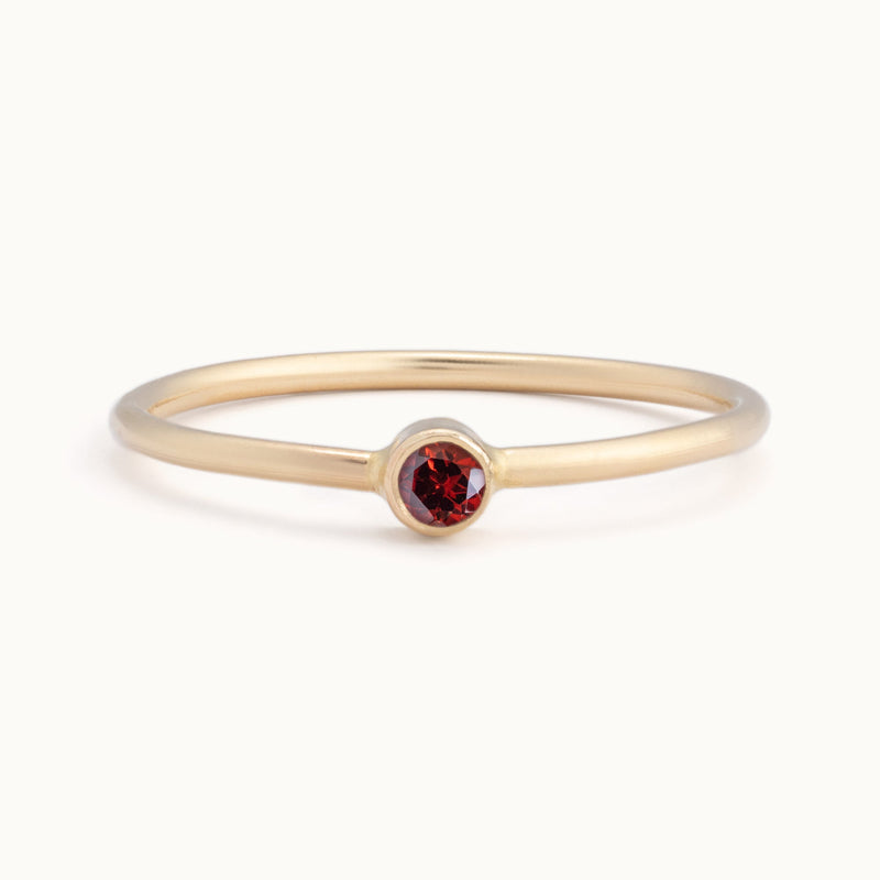 Custom Garnet Birthstone Stacking Ring | 10K Yellow Gold with white background. 