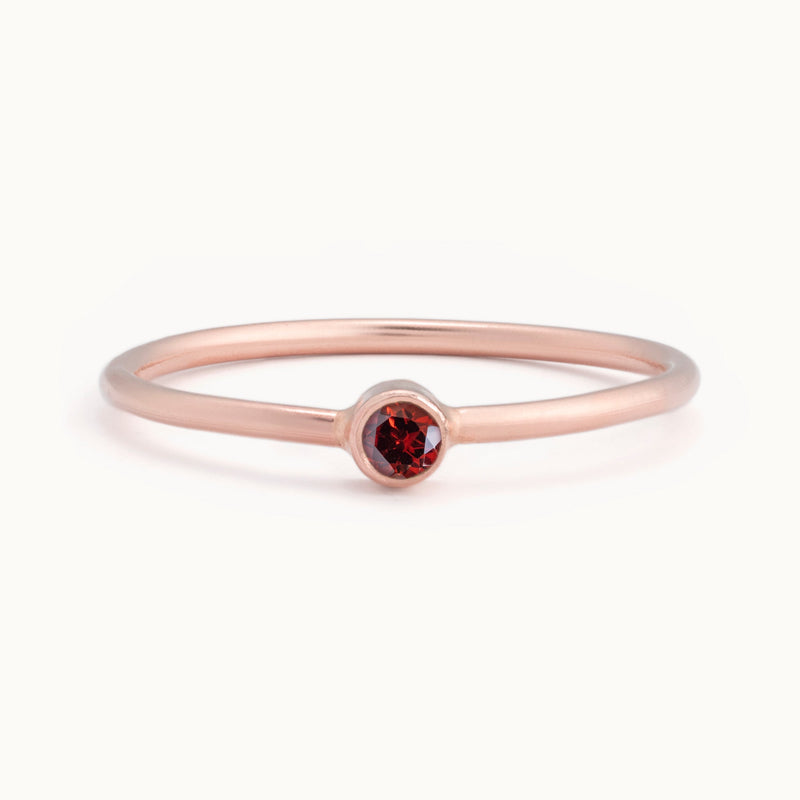 Custom Garnet Birthstone Stacking Ring | 10K Rose Gold with white background. 