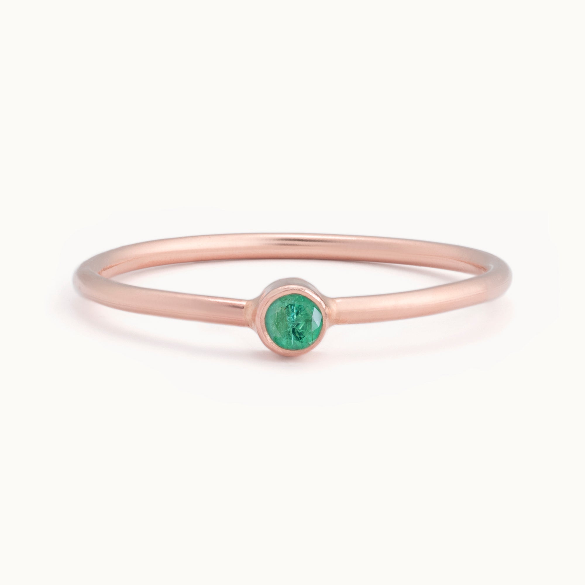 Custom Emerald Birthstone Stacking Ring | 10K Rose Gold with white background. 