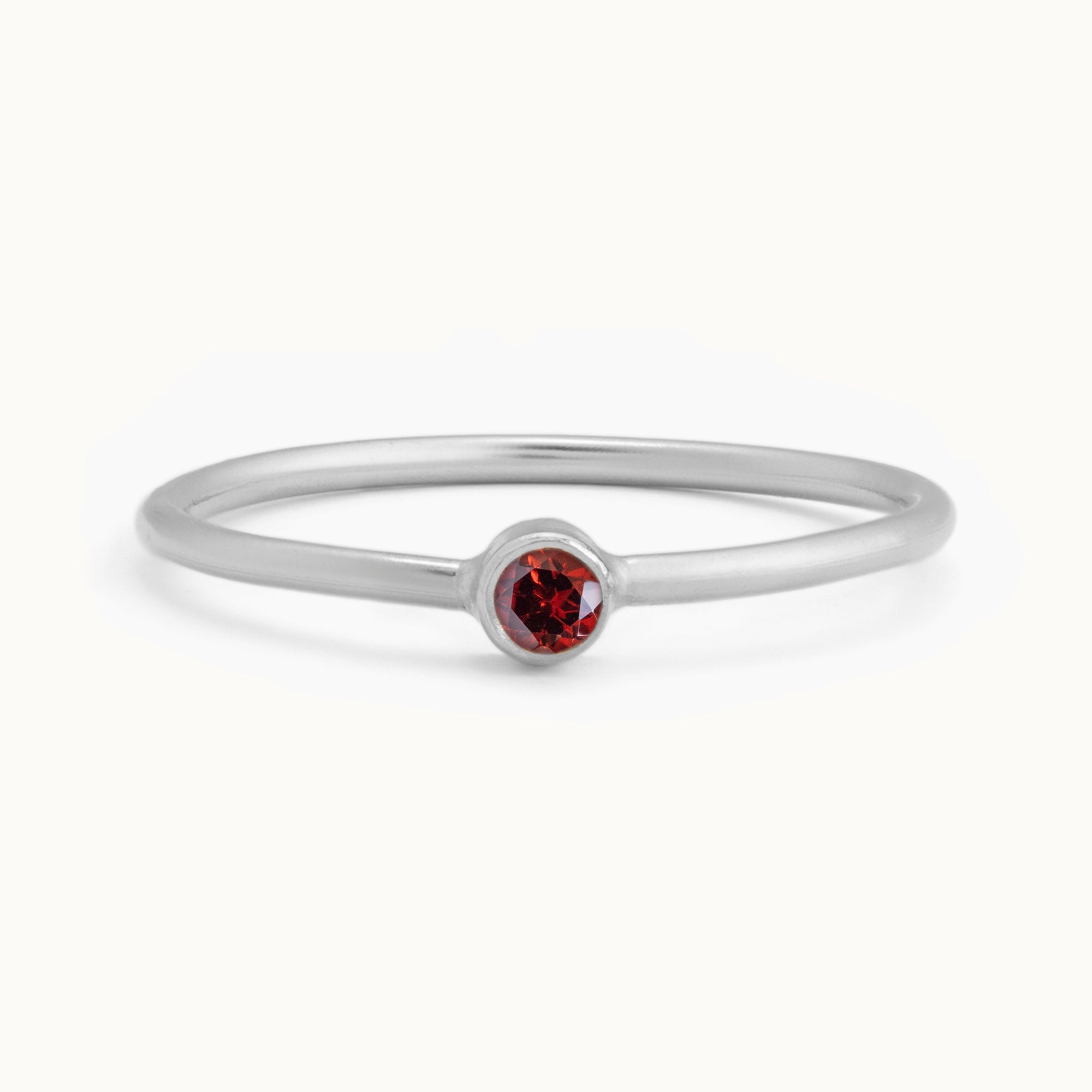 Custom Garnet Birthstone Stacking Ring | 10K White Gold with white background. 