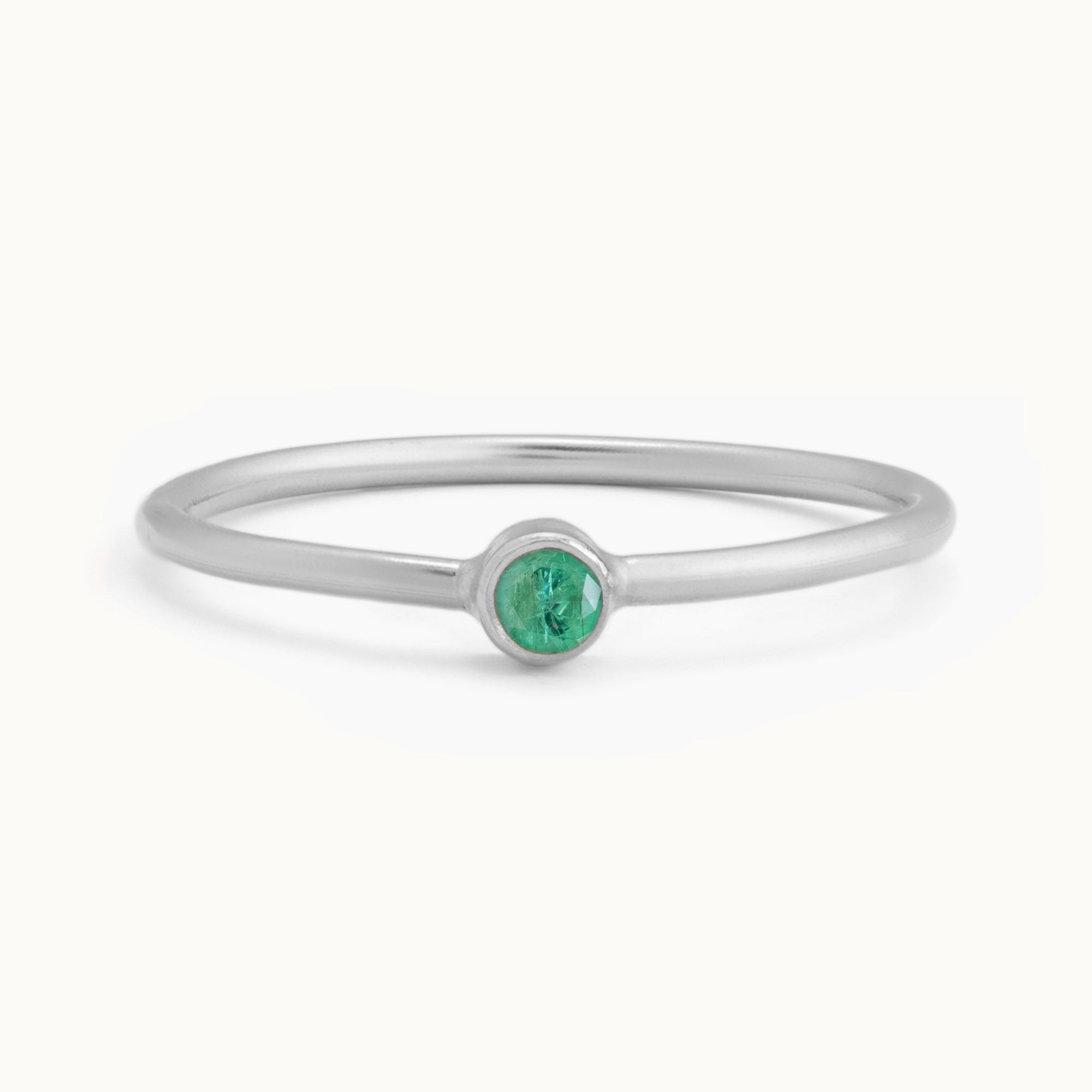 Custom Emerald Birthstone Stacking Ring | 10K White Gold with white background.