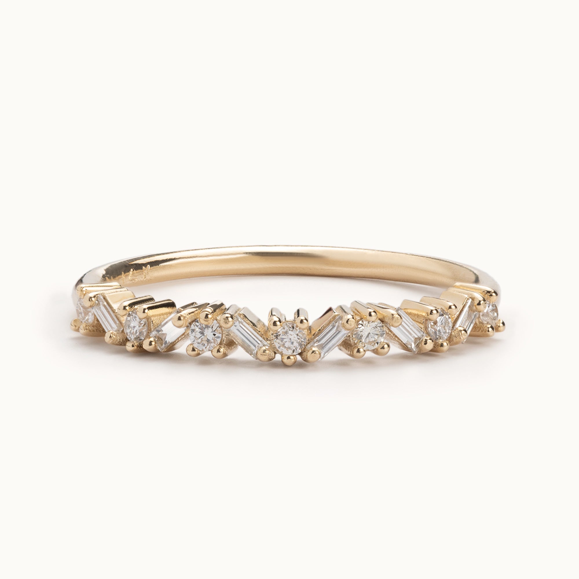 The Baguette Confetti Stacking Ring In Yellow Gold with white background 