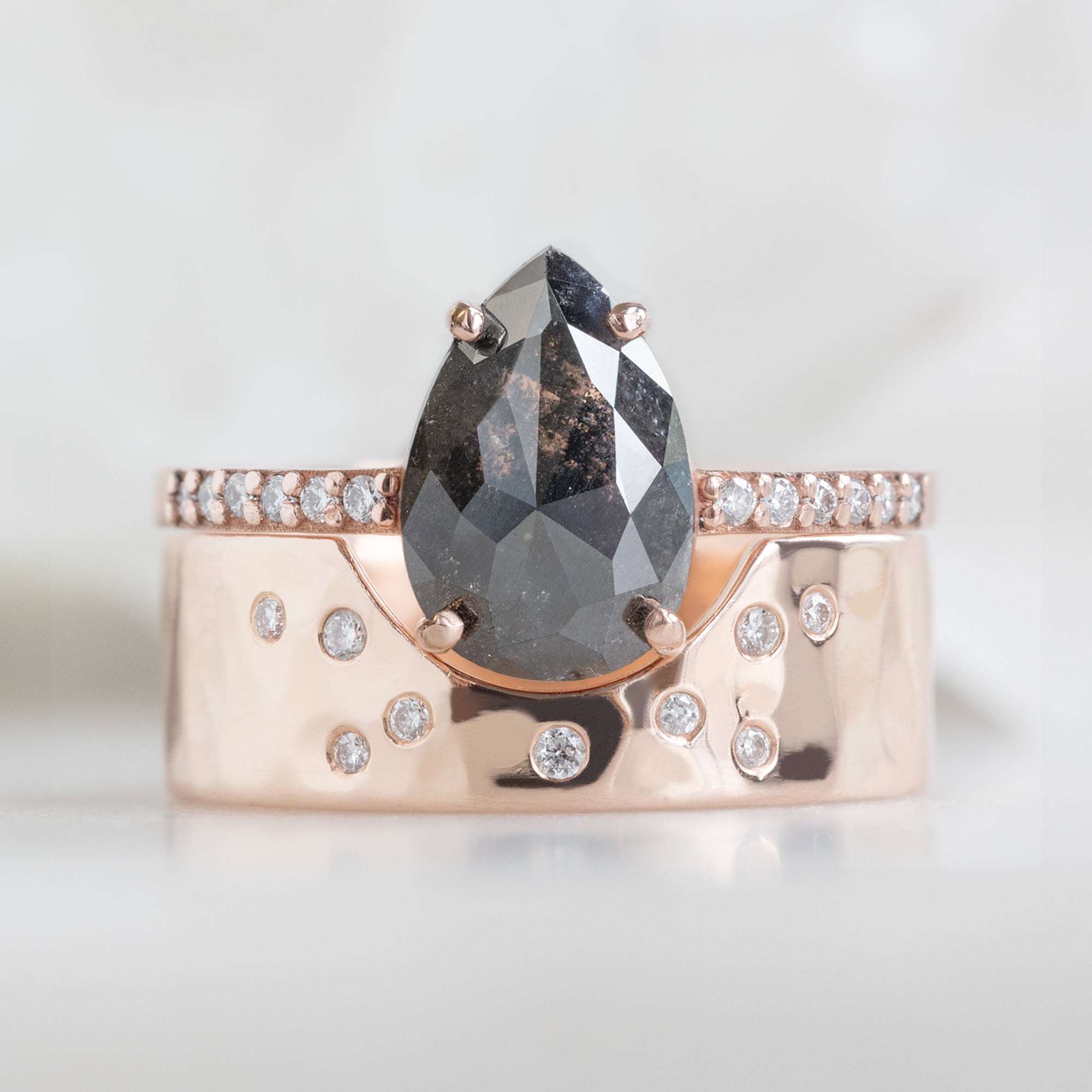 One of a Kind Constellation Arc Cut-Out Stacking Band in 14K Rose Gold Stacked with Black Diamond Pear Engagement Ring