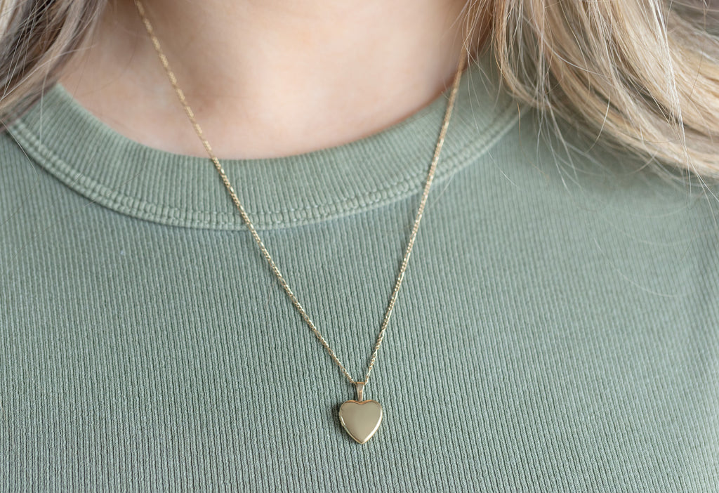 Yellow Gold Filled Mini Sweetheart Locket Necklace on Model wearing Green Ripped Tank