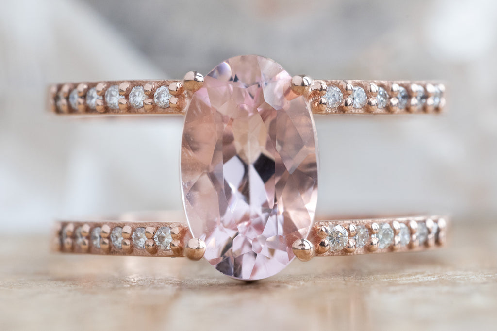 The Poppy Ring with an Oval-Cut Morganite on Wood Table